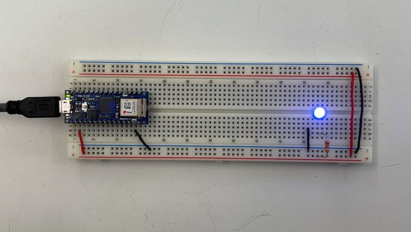 breadboard with arduino powering a blue LED