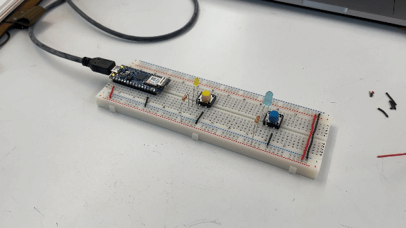 breadboard with arduino powering a blue LED with a switch and resistor